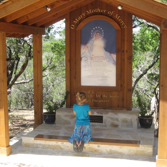 Child Praying at the Holy Souls Memorial