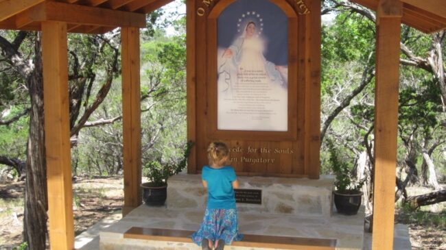 Child Praying at the Holy Souls Memorial